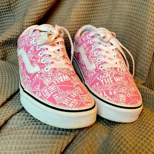 Pink and white Vans tennis shoes